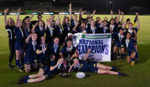 Photo of Women's Club Water Polo with the 2024 national champion banner.